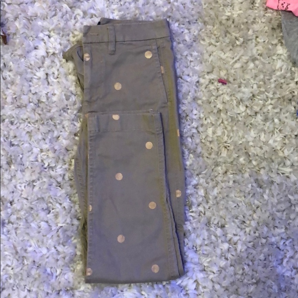 Full length tan pants with gold dots.